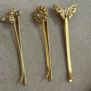 Vintage hair accessories. Gold tone butterfly, bee, and flower.